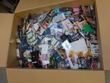 a cardboard box filled with many different types of cards