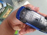 a person holding a cell phone in their hand