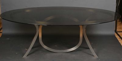 an image of a glass table with a metal base