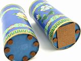two blue tubes with flowers on them on a white surface