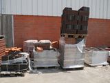 a pile of bricks sitting on a pallet in front of a building