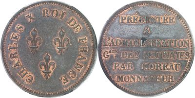 a close up of a coin on a white surface