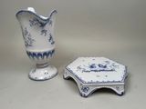 a white and blue vase and a blue and white plate