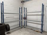 a garage with a tire and a tire rack in it