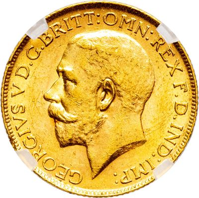 gros plan d'une pièce d'or sur laquelle figure le visage d'un homme