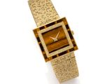 une photo d'une montre en or pour femme ornée d'un œil-de-tigre