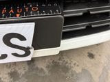 a close up of a car ' s front bumper with a sticker on it
