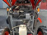 a small tractor with a large engine on the back