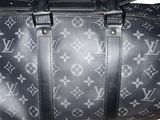 a black and white louis vuitton bag on a white background