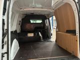 a white van with a wooden bed inside of it