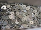 a lot of silver coins in a metal container