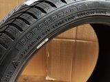 a close up of a tire on a cardboard box with a cardboard box in the background