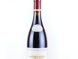 a bottle of wine that is sitting on a table