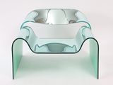 a glass table with a bowl on top of it
