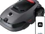 an image of a robotic lawn mower with a remote control