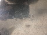 a silver plate with a picture of a man and a woman on it