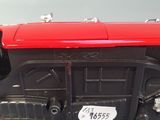 a red toy truck that is sitting on a table