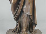 bronze statue of a woman holding a baby in her arms