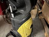a machine that is sitting on the floor next to a box