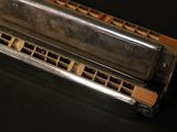 a harmonica that is sitting on a black table