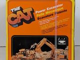 a box with a picture of a cat excavator in it