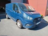 a blue van parked in front of a building