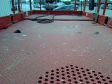 a red floor with holes in the middle of it