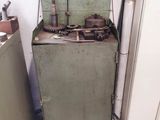 an old stove in the corner of a room that needs to be cleaned