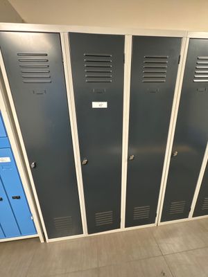 several lockers are lined up in a row in a room