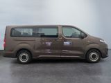 a picture of a brown van parked in a parking lot