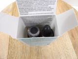 two bottles of wine in a box on a wooden table