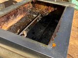 a toaster that has a lot of burnt food inside of it