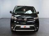 the front view of a black toyota sienna parked in a room