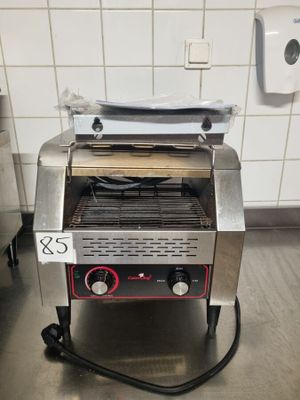 a toaster that is sitting on the floor in the kitchen