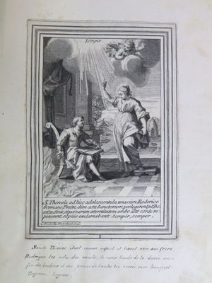 an old book with a picture of a man and a woman sitting on a bed