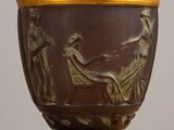 a vase that has a picture of a woman on it