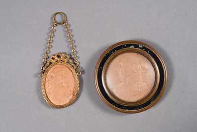 an image of a gold locke with a coin hanging from it