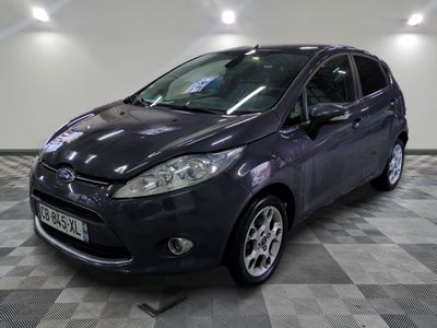 a picture of a grey ford fiesta parked in a garage