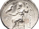 a close up of a silver coin with an image of a woman and a bird on it