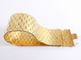 gold plated bracelet with hexagons on a white background