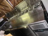 a large stainless steel oven that is in the kitchen