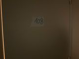 a sign on the door of a bathroom that says 80
