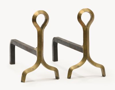 pair of brass and black iron bookends on a white background