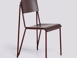 the chair is made of wood and has a brown leather seat