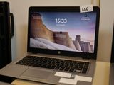 a laptop that is sitting on a desk with a price tag on it