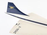 a model of a plane on a stand on a white surface