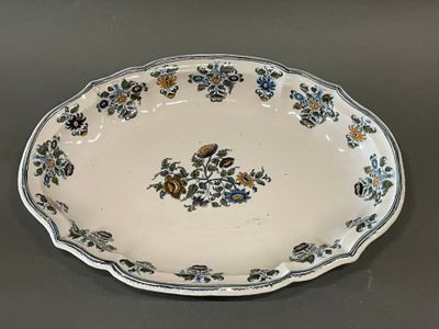 a white plate with blue and yellow flowers on it