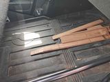 a truck bed with wood in the back of it