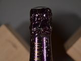 a bottle of wine that is sitting on a table