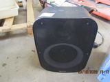 a speaker that is sitting on the floor in the room